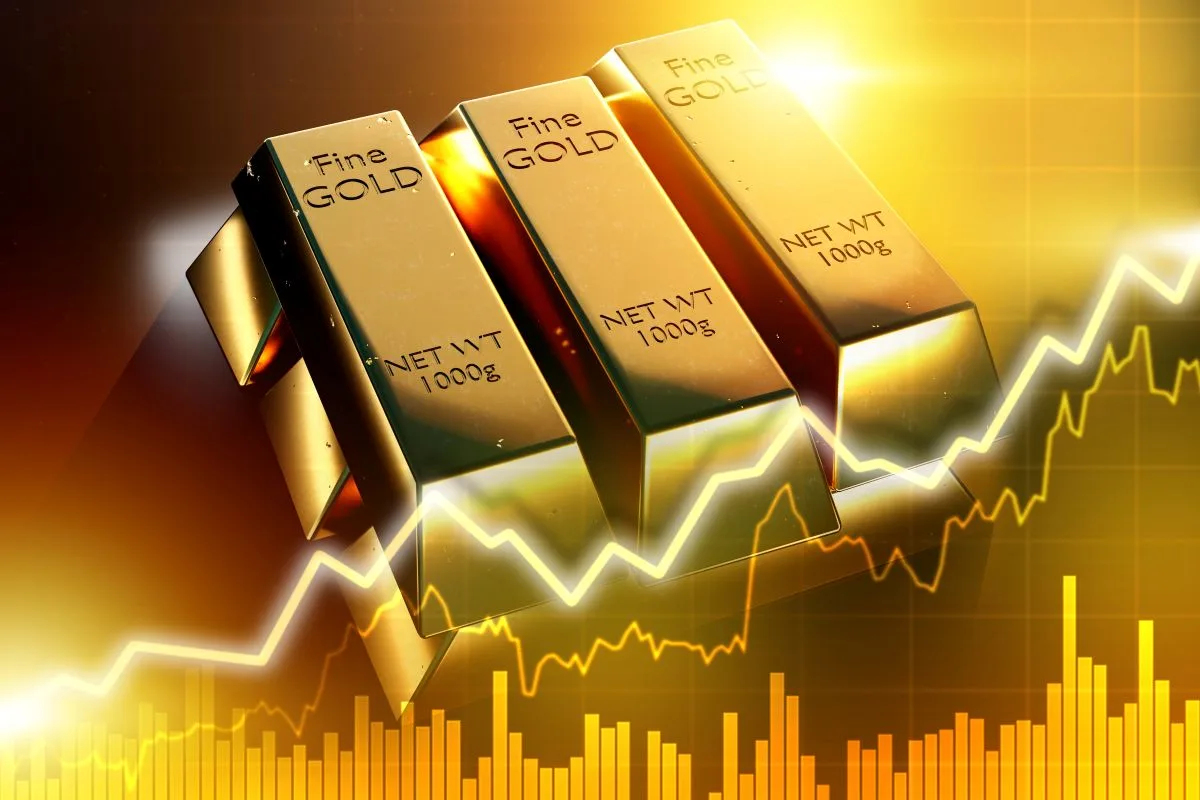 سبائك الذهب الخالص مع رسوم بياني صاعد يعكس ارتفاع أسعار الذهب
